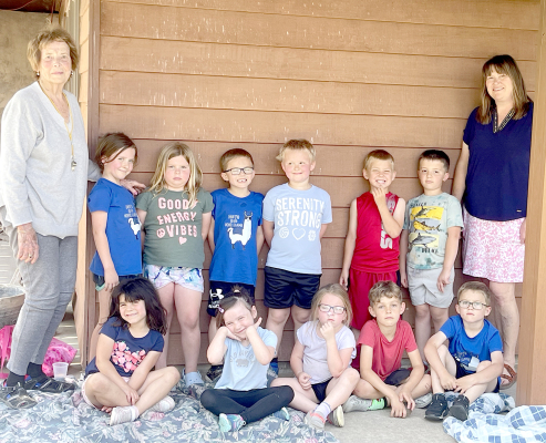 The Kindergarten class of Mrs. Deirdra Kuhlmann was treated to a few hours of fun at the home of Joan Balderston. This end-of-school event found the students playing with large boxes, bubbles, running around, dancing, jumping rope, and doing whatever else they imagined. Enjoying the fun day were front row, from left: Kamyah Gallaway, Raylyn Swaney, Grace Towne, Ned Berkley, Jax Miller; and back row, from left: Joan Balderston, Coralie Armstrong, Braylee Muir, Jasper Miller, Charles Reed, Braxton Ghumm, Kyle