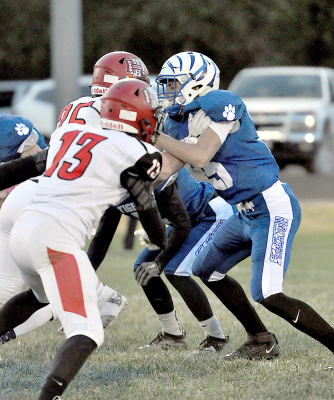 Nolan Buss battles it out on the line against his Hoxie Indian opponents during the game held last Friday at Tiger Stadium.
