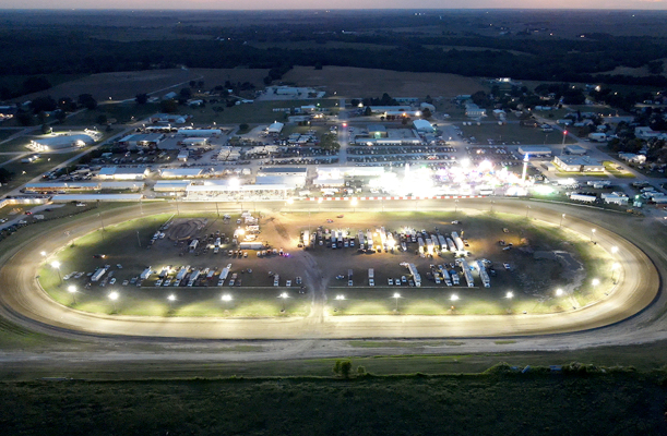 A drone’s-eye view of the Rooks County Free Fair at night not only captures the lights of the carnival, but also the historic half-mile racetrack and much of the fairgrounds. Next year’s shot will have a different look as the track will have been converted to a 3/8-mile oval.                         (Photo courtesy of Adam Bryant)