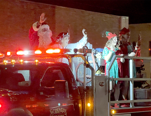 Santa, Mrs. Claus and the elves arrive at the Olde Tyme Christmas celebration on Friday, November 26.