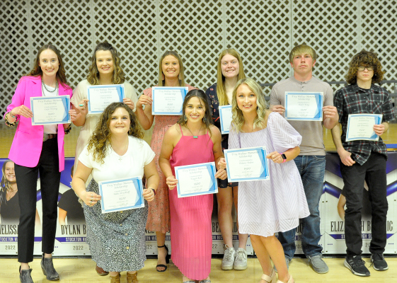 TREY WALLACE MEMORIAL SCHOLARSHIP WINNERS receiving their certificates at the annual Awards Banquet were nine of his classmates. They are front row, from left: Addie Struckhoff, Taigen Kerr and Delanee Bedore; and back row: Cappi Hoeting, Tierra Yohon, Melissa Ard, Elizabeth Busonic, Skylar King, and Jake Benavides. The Wallace Family awarded the one-year, one-time scholarships in memory of Trey, who passed away in a drowning accident just before his freshman year of high school.