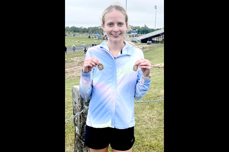 Cheyenne Hoeting with her 3200 &amp; 1600 Meter Medals she captured at Regionals (Courtesy Photo)