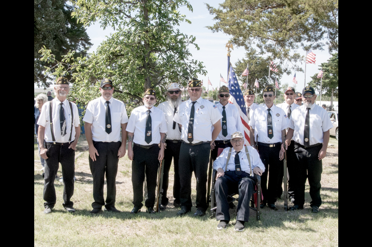 Members of VFW Post 8873 conducted Memorial Day services at Stockton Cemetery on Monday, honoring the men and women who made the ultimate sacrifice in service to their country. From left are: Rick Maynard, Tim Johnston, Quinn Baize, Charlie Sander, Shayn Balthazor, Mark Trumbo, John Berkley (seated), Ed Thayer, David Atwood, Benney Wise, and Mack Palmer.
